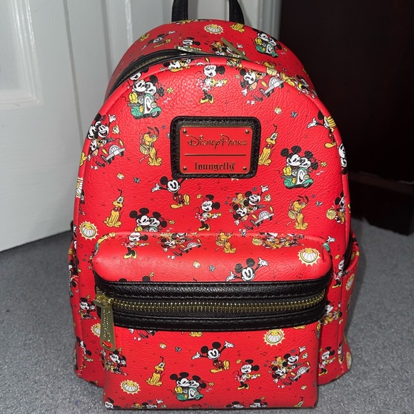 Loungefly Handbags - Loungefly Disney Parks Red Character Backpack